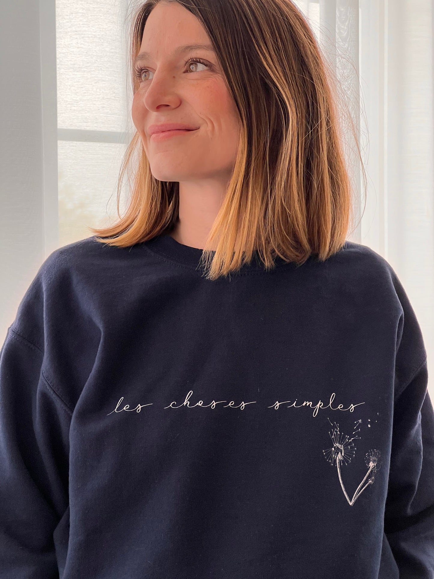 "Les choses simples" is French for “the simple things".  The simplest things, those from our everyday lives, are often the things that add the most meaning to it. This durable, cozy sweatshirt will keep you warm and stylish as you enjoy the simple things of life: a hot cup of coffee, an evening out (or in) with friends...  This ultra-soft pre-shrunk sweatshirt features a loose fit for a comfortable feel.
