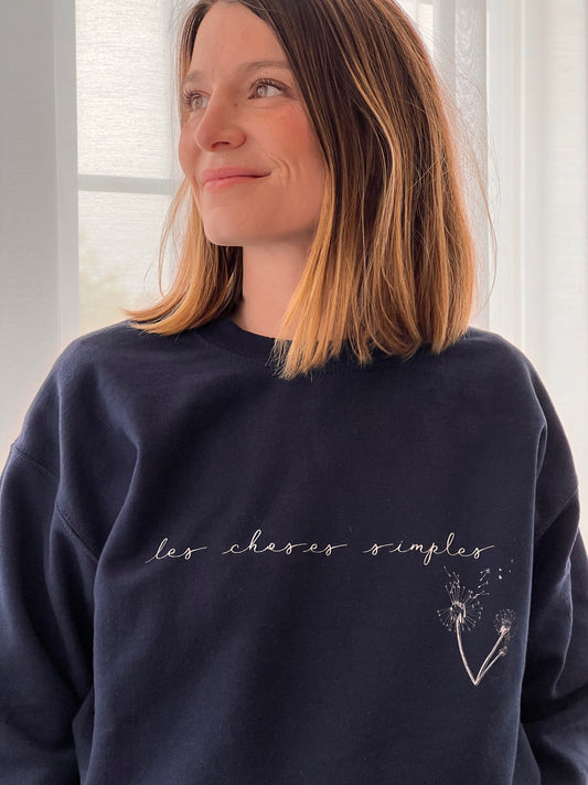 "Les choses simples" is French for “the simple things".  The simplest things, those from our everyday lives, are often the things that add the most meaning to it. This durable, cozy sweatshirt will keep you warm and stylish as you enjoy the simple things of life: a hot cup of coffee, an evening out (or in) with friends...  This ultra-soft pre-shrunk sweatshirt features a loose fit for a comfortable feel.