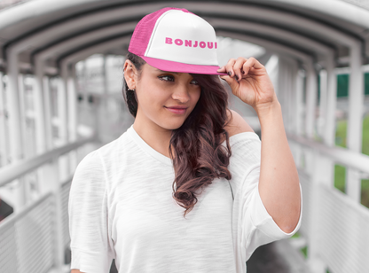 Say hello but in French! This trucker hat adds a charming and playful finishing touch for any summertime look. Pink hat caps trucker caps